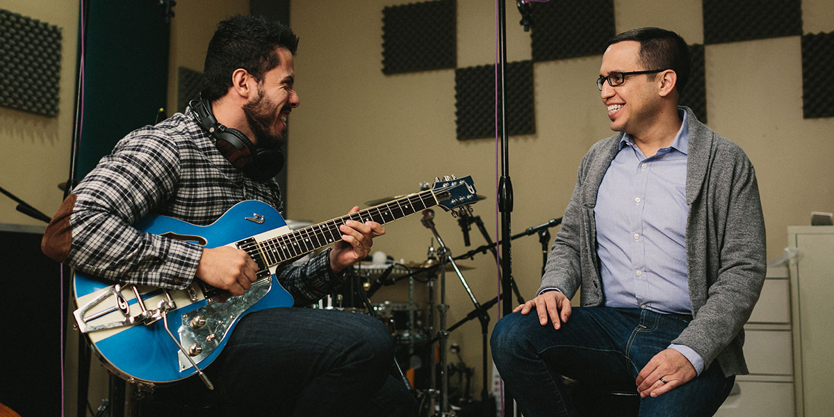 Henry Alonzo and guitarist in the studio